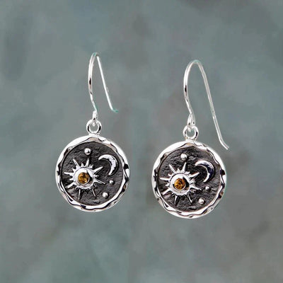 Earrings with sun and moon in gold and silver